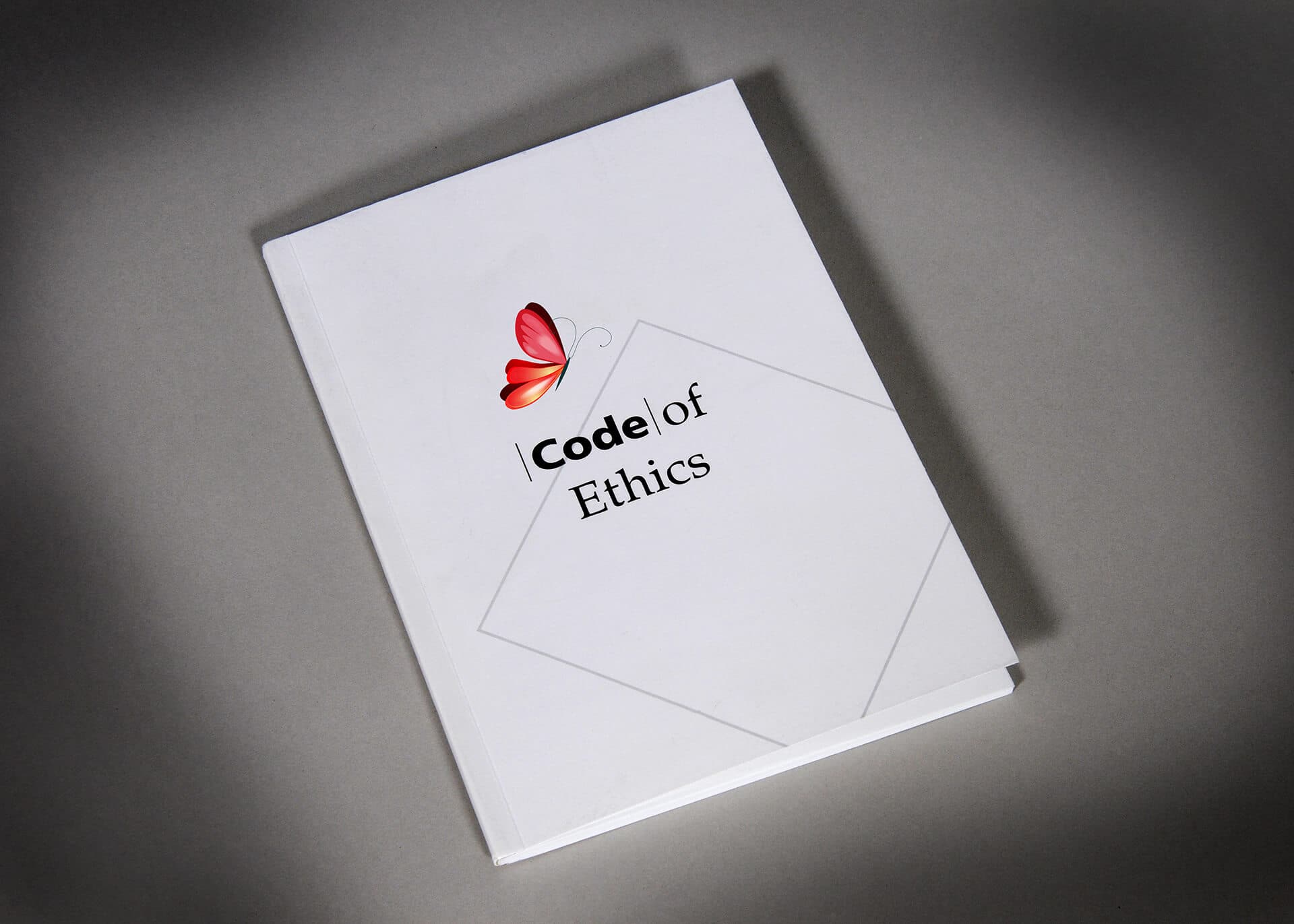 A manual that says code of ethics with the red Mariposa logo