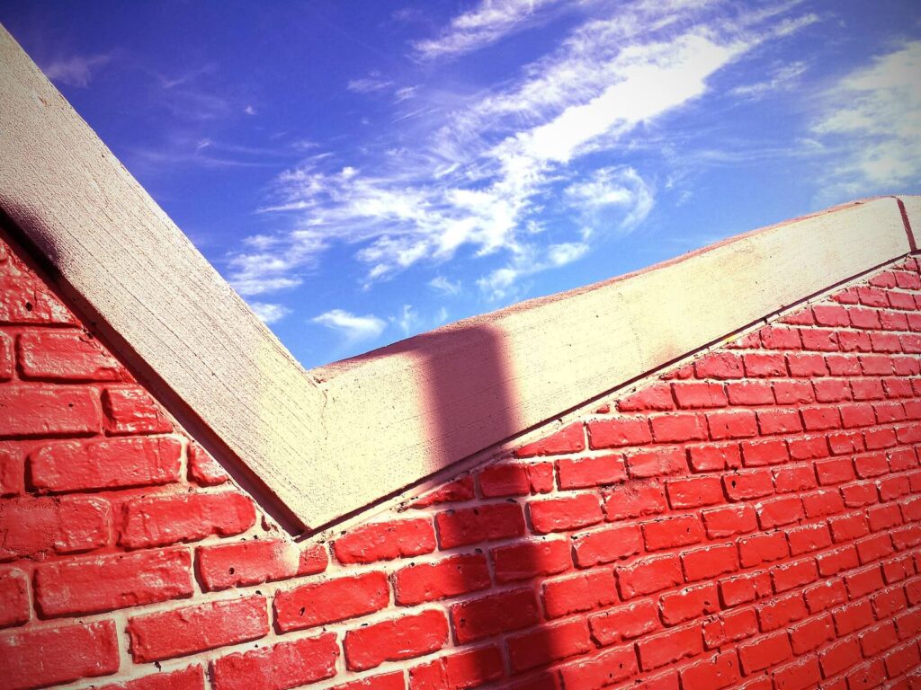 A brick wall making a checkmark against the sky